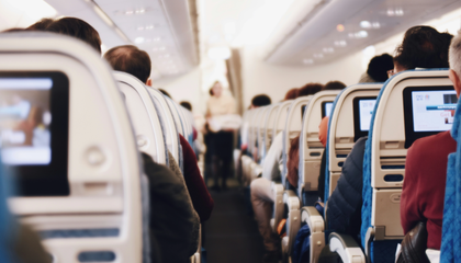 Airplane aisle during flight | © Unsplash / Suhyeon Choi